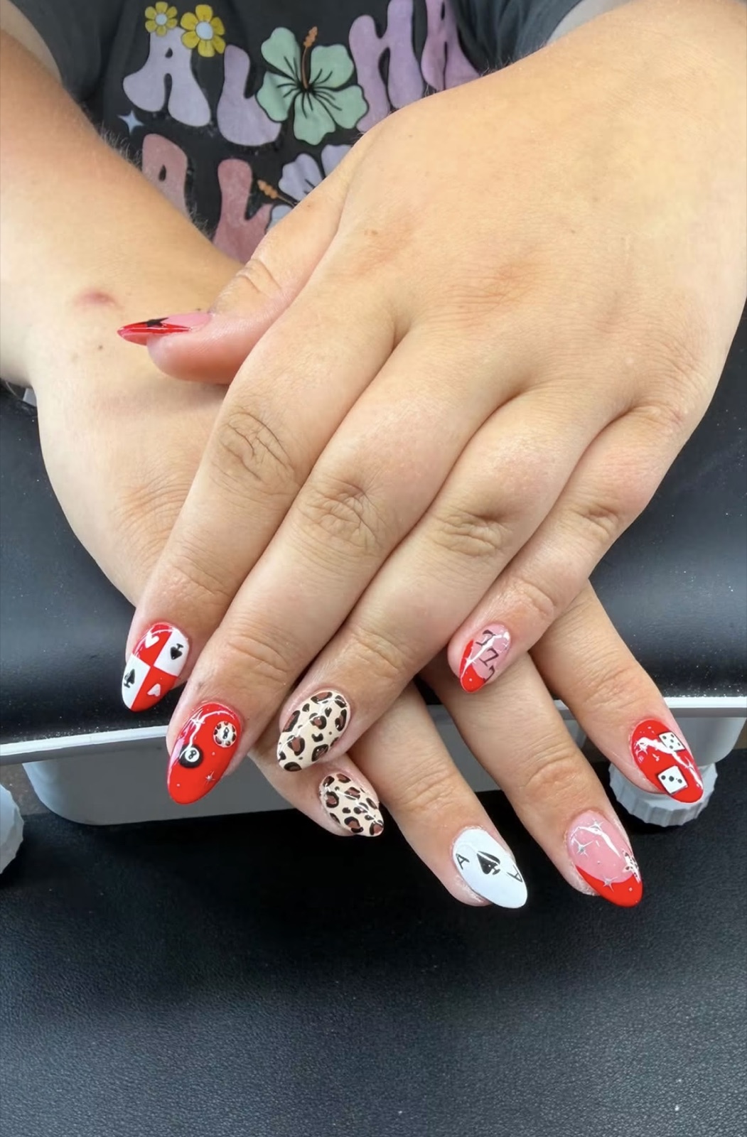 Red, pink, and leopard-print casino nail art by Cheyenne Anderson