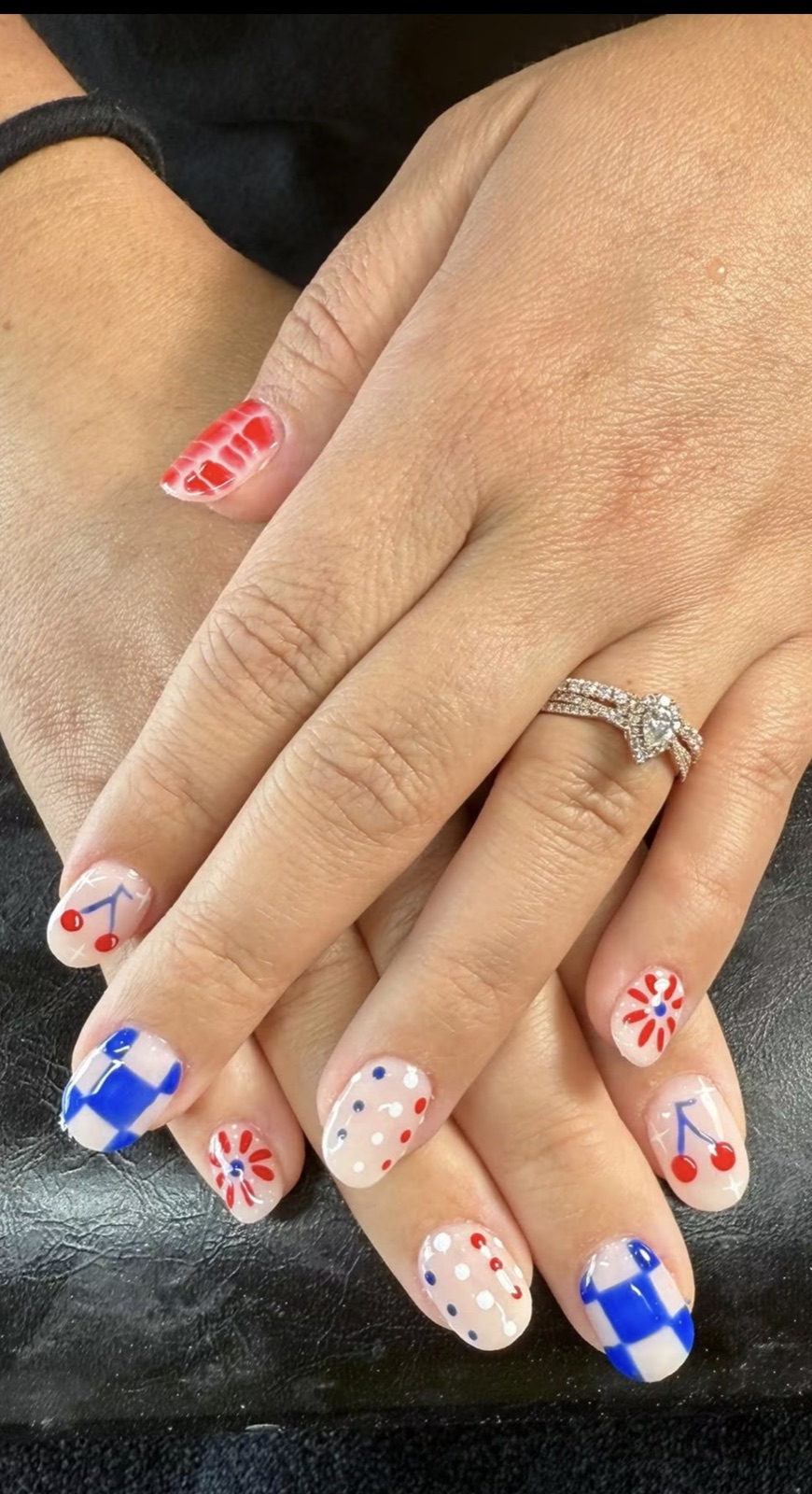 Red, white, and blue cherry and checker nail art by Cheyenne Anderson