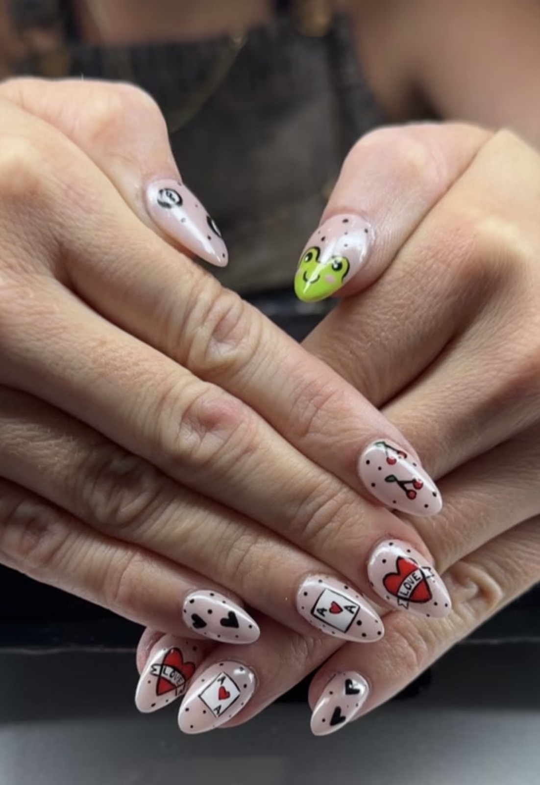 Pink playing-card, cherry, heart, and frog nail art by Cheyenne Anderson