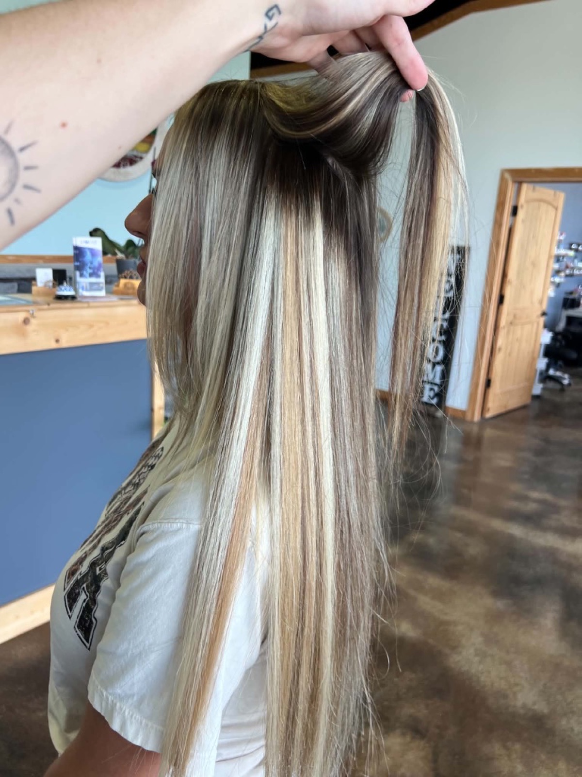 Long dimensional blonde hair extensions by Jade Ferguson