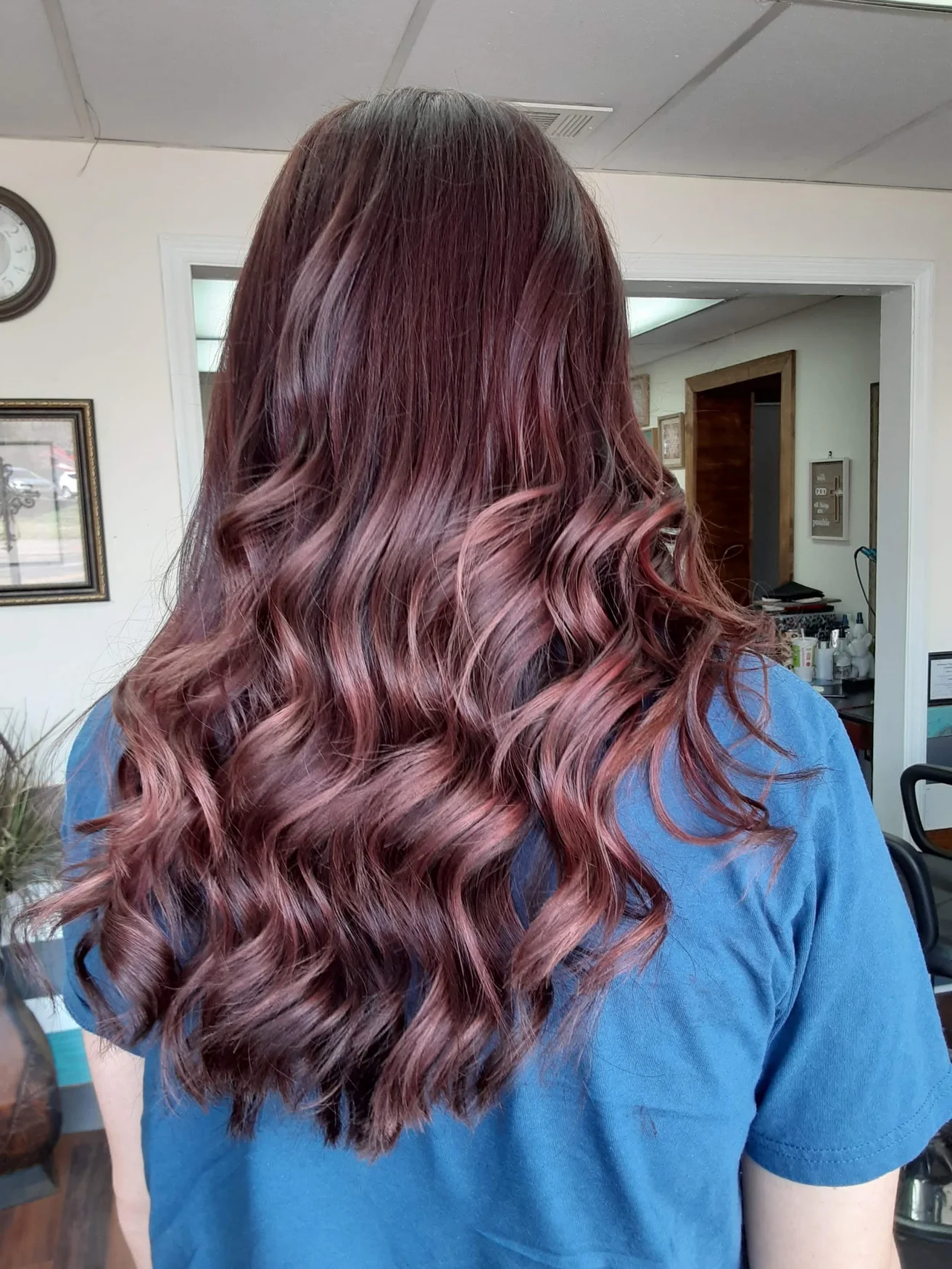 Rich auburn hair color styled in long curls by Kristen Wilhite