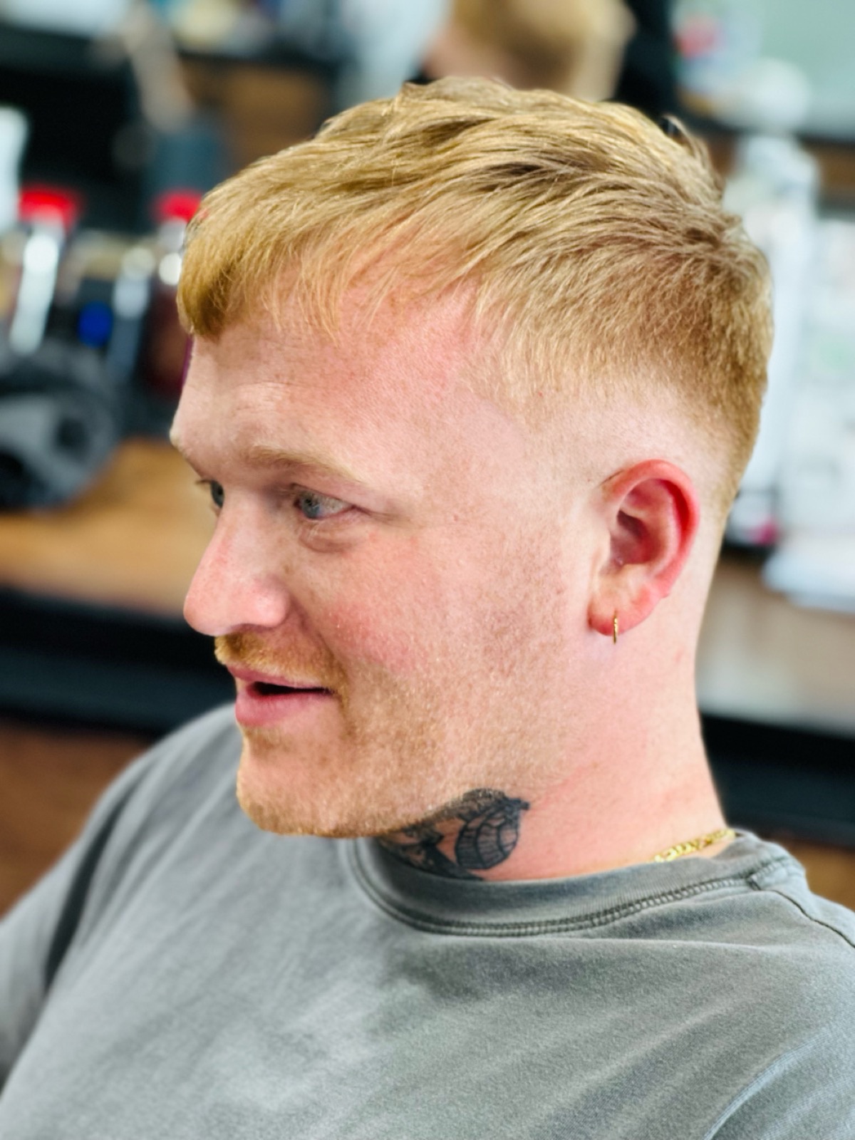 Blonde men’s fade haircut by Natalie Garrido