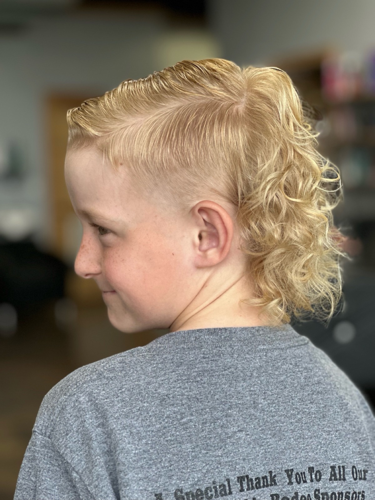 Blonde curly mohawk hairstyle by Natalie Garrido