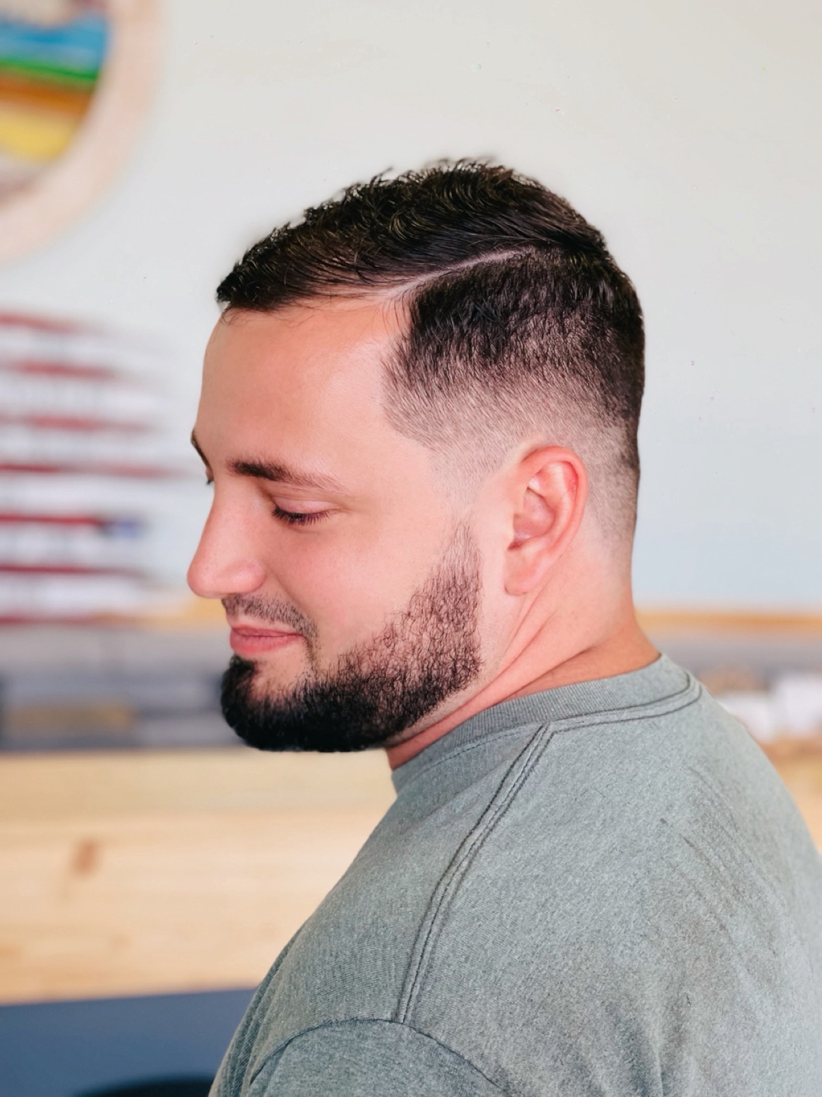 Dark men’s fade haircut and styling by Natalie Garrido